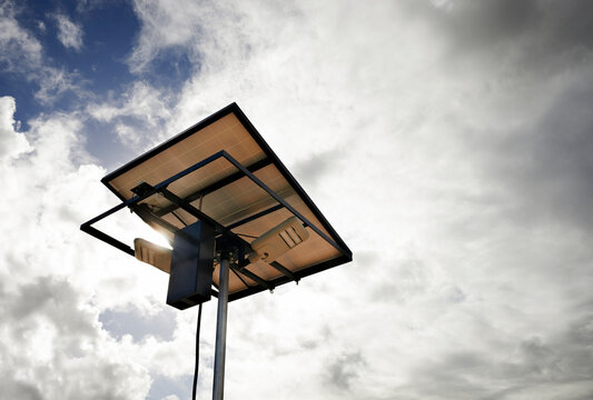 Transportable solar panel against stormy sky