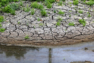 Dried up lake in Europe, due to prolonged drought and lack of rain. The bottom is dry, so the clear...