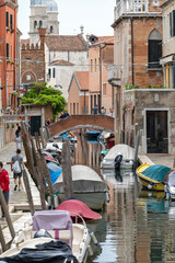 Narrow canal in the city of Venice on a summer day
