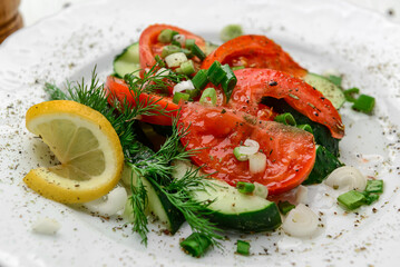Cucumber, tomato and green onion salad with olive oil
