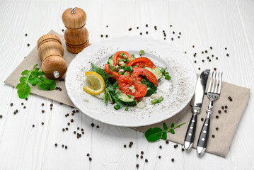 Cucumber, tomato and green onion salad with olive oil