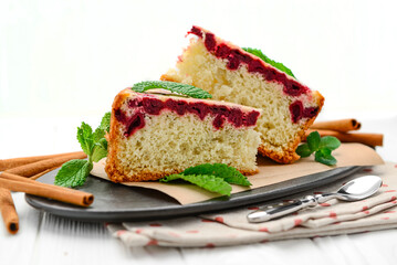 Sponge cake with cherries and cinnamon.