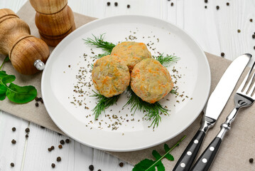 Steamed chicken cutlets with vegetables.