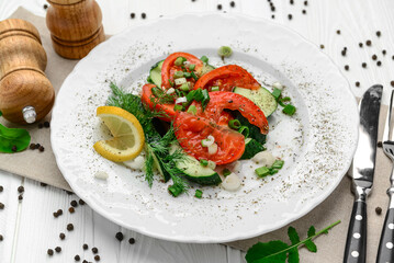 Cucumber, tomato and green onion salad with olive oil