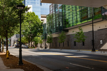 Fototapeta na wymiar Uptown urban street lined with glass office buildings