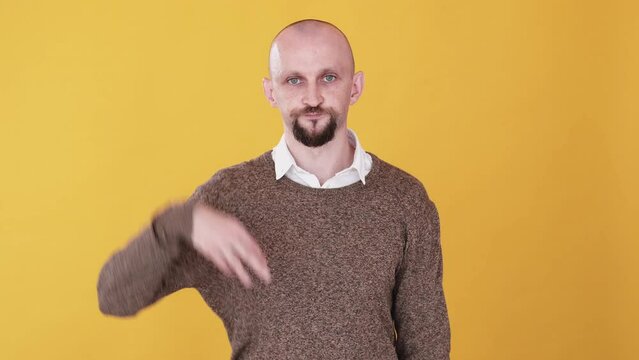 Sprinkling gesture. Flavoring food. Boomerang animation. Funny expression. Cook recipe. Confident comic guy adding pinch of something gif loop isolated on yellow free space background.