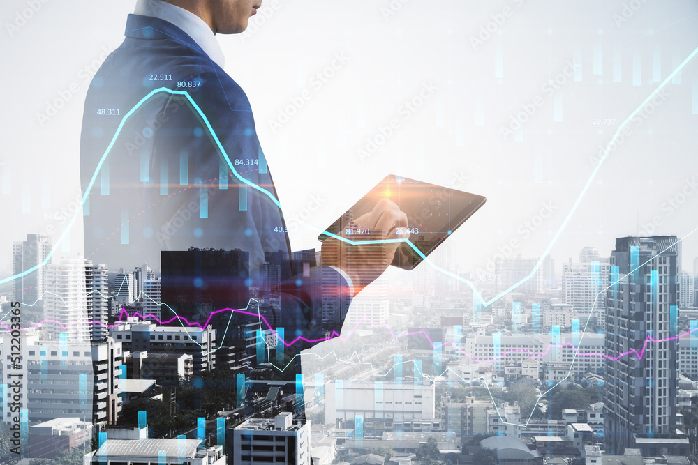 Aufkleber headless young european businessman using pad while standing on abstract bright city background with