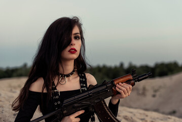 Girl with a gun in her hands