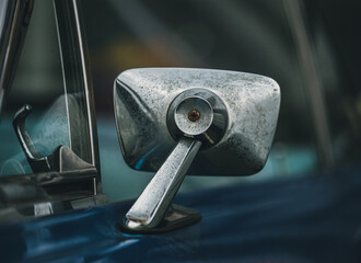 Classic car background. Close-up of the side mirror of a classic design. Vintage car wallpaper....