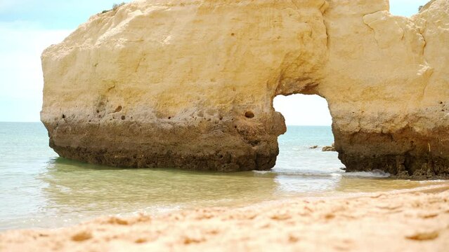 The rocky cliffs of Vale do Olival beach in Armacao de Pera, Portugal. High quality 4k footage