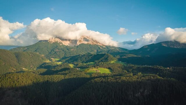 aerial hyperlapse of sunny latemar mountain and valley landscape