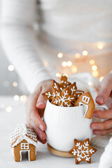 Christmas composition with gingerbread cookies and marshmallow in a white mug. Cozy home...