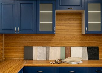 Furniture production. Catalog of samples of materials for kitchen countertops, facades made of...