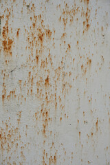 Old sheet of metal with rusty streaks.