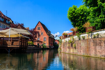 Traditional colourful half-timbered houses alongside the Lauch river in Little Venice district in Colmar, Alsace, France