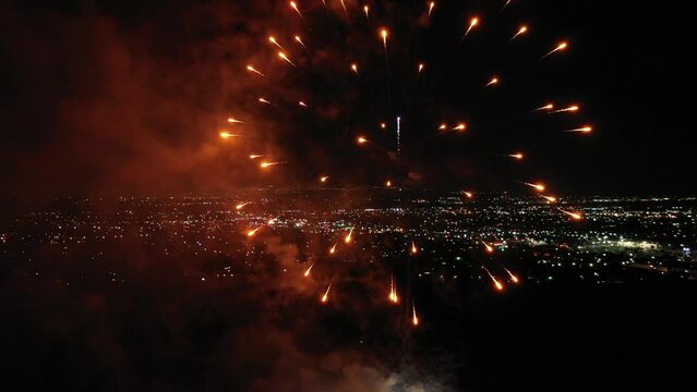 Aerial view of the 4th of July celebration with fireworks exploding in the air after dark