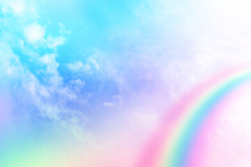 Colorful sky with soft white clouds and the crossing of rainbows. pastel colored magical fantasy...