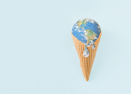 Planet Earth is melting in ice cream cone on isolated pastel blue background. Minimal concept of warming, melting, pollutions. Anti-war idea. Dystopian climate change future. World provided by NASA.