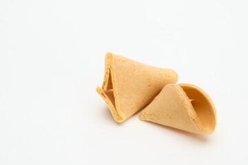 fortune cookie broken with cracked edges showing isolated on white 