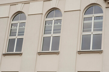 Fototapeta na wymiar View on building with three arched windows