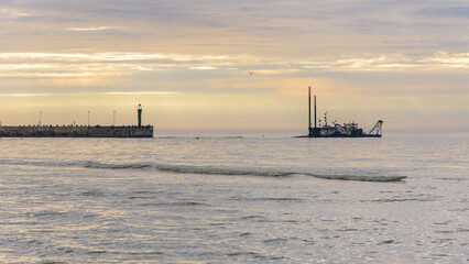 Port entrance in Leba in Poland at sunset