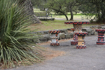 bench in a square with strong colors, flower park with a path of folders, uruguay, Montevideo