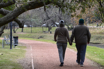 Beautiful loving couple going for a walk outdoors.	
