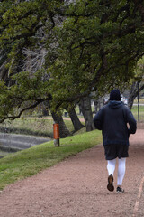 Fototapeta premium man running, doing exercise in an open park, January 10, 2022 