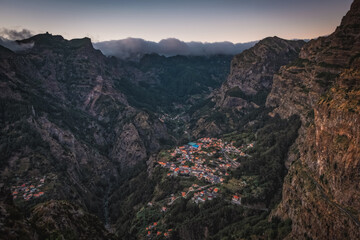 Fototapeta premium Curral das Freiras - Beautiful view of mountain range and little village in Madeira Island, Portugal. October 2021