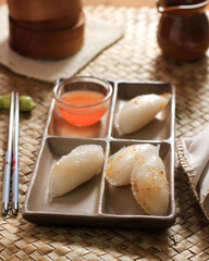 Fototapeta na wymiar Choipan or Chai Kue, Traditional Savory Snack from Pontianak, Indonesia. Made from Rice Flour, Filled with Sweet Potato and Taro, Served with Sweet and Sour Sauce. Adapted from Chinese Dimsum. 