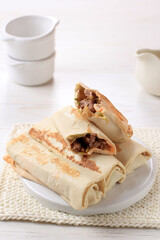 Isolated White Background Frozen Kebab or Shawarma Roll  Close up of Street Food Stall Cooking Fresh Asian kebab. Meat Wrapped with Shawarma