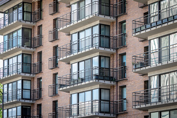 Fototapeta na wymiar Exterior of a Multilevel Apartment Complex With Apartment Balconies