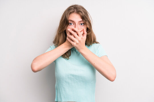 teenager young girl covering mouth with hands with a shocked, surprised expression, keeping a secret or saying oops