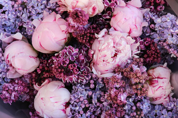 Floral flowers background texture. Pink peonies and purple violet blue lilac in bouquet close-up © Viktor Iden