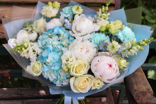 Beautiful rich elegant soft wedding pink blue yellow white bouquet with rose, peony and blue flowers