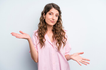 young adult pretty woman feeling puzzled and confused, unsure about the correct answer or decision,...