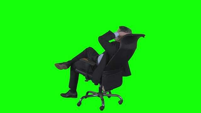 Rear view of male manager relaxing on office chair