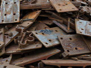 Pile of railroad t plates, spikes  and clips for recycle
