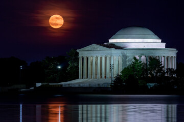 The super moon on June 14, 2022 rises over the Jefferson Memorial in Washington, DC