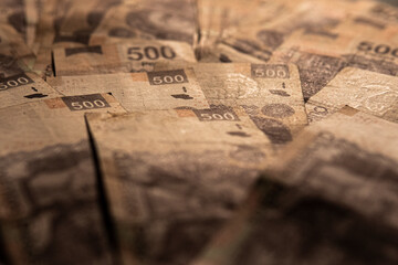 Money piled on a table, mexican peso currency