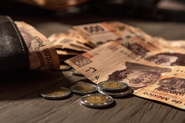 Money piled on a table, mexican peso currency