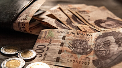 Money piled on a table, mexican peso currency