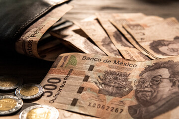 Money piled on a table, mexican peso currency