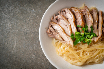 dried duck noodles in white bowl