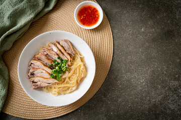 dried duck noodles in white bowl