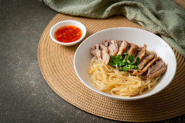 dried duck noodles in white bowl