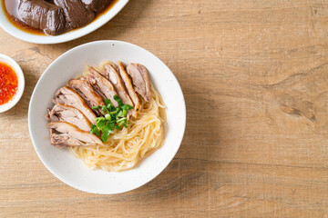 dried duck noodles in white bowl