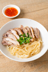 dried duck noodles in white bowl
