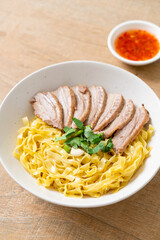 dried duck noodles in white bowl