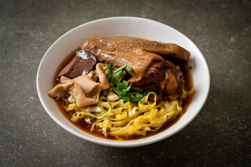 egg noodles with stewed and braised duck in brown soup